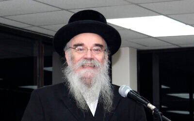 In this December 20, 2017, photo provided by Joel Friedman, Rabbi Avrohom Pinter makes a speech at Canvey Island,in Essex, southeast England. (Joel Friedman via AP)