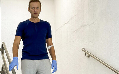In this photo taken from a video published by Russian opposition leader Alexei Navalny on his instagram account, Russian opposition leader Alexei Navalny walks down stairs in a hospital in Berlin, Germany, Saturday, Sept. 19, 2020. The German hospital treating Russian opposition leader Alexei Navalny for poisoning says his condition improved enough for him to be released from the facility. The Charite hospital in Berlin said Wednesday Sept. 23, 2020 that after 32 days in care, Navalny's condition "improved sufficiently for him to be discharged from acute inpatient care." (Navalny Instagram via AP)