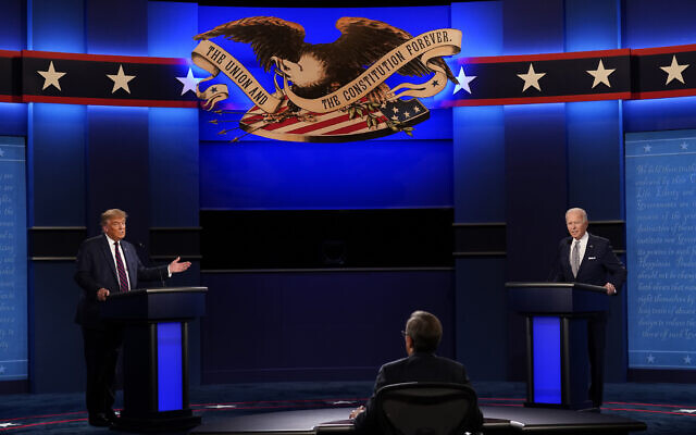 Moderator Chris Wallace of Fox News listens as US President Donald Trump and Democratic candidate Joe Biden participate in the first presidential debate September 29, 2020, at Case Western University and Cleveland Clinic, in Cleveland, Ohio. (AP Photo/Patrick Semansky)