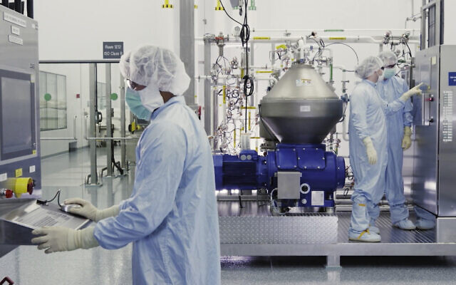 Illustrative: In this undated image from video provided by Regeneron Pharmaceuticals on Friday, October 2, 2020, scientists work with a bioreactor at a company facility in New York state, for efforts on an experimental coronavirus antibody drug. (Regeneron via AP) Illustrative: In this undated image from video provided by Regeneron Pharmaceuticals on Friday, October 2, 2020, scientists work with a bioreactor at a company facility in New York state, for efforts on an experimental coronavirus antibody drug. (Regeneron via AP)