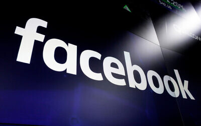 The logo for social media giant Facebook is seen at the Nasdaq MarketSite in New York's Times Square, March 29, 2018. (AP Photo/Richard Drew, File)