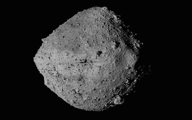 This undated image made available by NASA shows the asteroid Bennu from the OSIRIS-REx spacecraft. After almost two years circling the ancient asteroid, OSIRIS-REx will attempt to descend to the treacherous, boulder-packed surface and snatch a handful of rubble on Tuesday, Oct. 20, 2020. (NASA/Goddard/University of Arizona/CSA/York/MDA via AP) This undated image made available by NASA shows the asteroid Bennu from the OSIRIS-REx spacecraft. After almost two years circling the ancient asteroid, OSIRIS-REx will attempt to descend to the treacherous, boulder-packed surface and snatch a handful of rubble on Tuesday, Oct. 20, 2020. (NASA/Goddard/University of Arizona/CSA/York/MDA via AP)