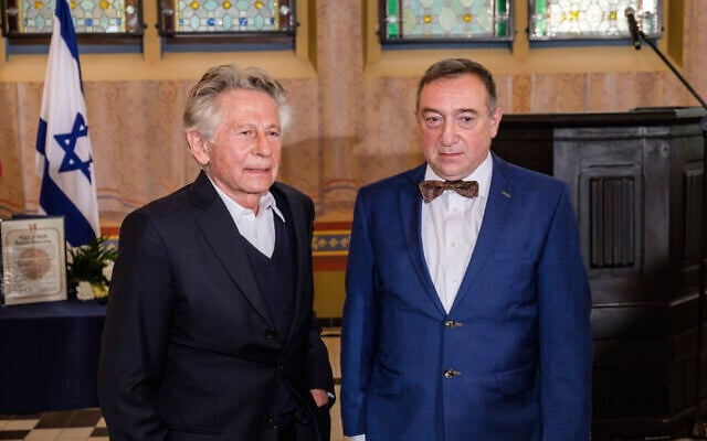 Oscar-winning filmmaker Roman Polanski, left, poses for the media with Stanislaw Buchala, right, who received the Israeli distinction of the Righteous Among the Nations on behalf of his late grandparents, Stefania and Jan Buchala, who saved Polanski, from the Holocaust in 1943-45, during the ceremony of bestowing the honor in Gliwice, Poland, October 15, 2020.(Michal Buksa/AP) Oscar-winning filmmaker Roman Polanski, left, poses for the media with Stanislaw Buchala, right, who received the Israeli distinction of the Righteous Among the Nations on behalf of his late grandparents, Stefania and Jan Buchala, who saved Polanski, from the Holocaust in 1943-45, during the ceremony of bestowing the honor in Gliwice, Poland, October 15, 2020.(Michal Buksa/AP)