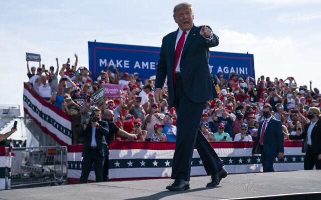 President Donald Trump arrives to speak to a campaign rally at Ocala International Airport, Friday, Oct. 16, 2020, in Ocala, Fla. (AP Photo/Evan Vucci) President Donald Trump arrives to speak to a campaign rally at Ocala International Airport, Friday, Oct. 16, 2020, in Ocala, Fla. (AP Photo/Evan Vucci)