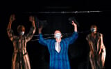 Actresses of the Jewish State Theater, wearing face masks for protection against COVID-19 infection, perform during the rehearsals for the premiere of the "The Beautiful Days of My Youth" play, based on the diary of Romanian Jewish Holocaust survivor Ana Novac, in Bucharest, October 15, 2020. (AP Photo/Andreea Alexandru)