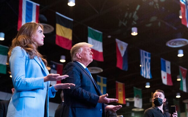US President Donald Trump closes his eyes as he accepts blessings as he attends church at International Church of Las Vegas, Sunday, Oct. 18, 2020, in Las Vegas, Nev. Counselor to the President Hope Hicks is at left. (AP Photo/Alex Brandon) US President Donald Trump closes his eyes as he accepts blessings as he attends church at International Church of Las Vegas, Sunday, Oct. 18, 2020, in Las Vegas, Nev. Counselor to the President Hope Hicks is at left. (AP Photo/Alex Brandon)