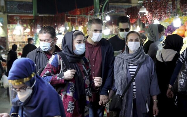 People wear protective face masks to help prevent the spread of the coronavirus, in the Tajrish traditional bazaar in northern Tehran, Iran, October 15, 2020. (AP Photo/Ebrahim Noroozi, File) People wear protective face masks to help prevent the spread of the coronavirus, in the Tajrish traditional bazaar in northern Tehran, Iran, October 15, 2020. (AP Photo/Ebrahim Noroozi, File)