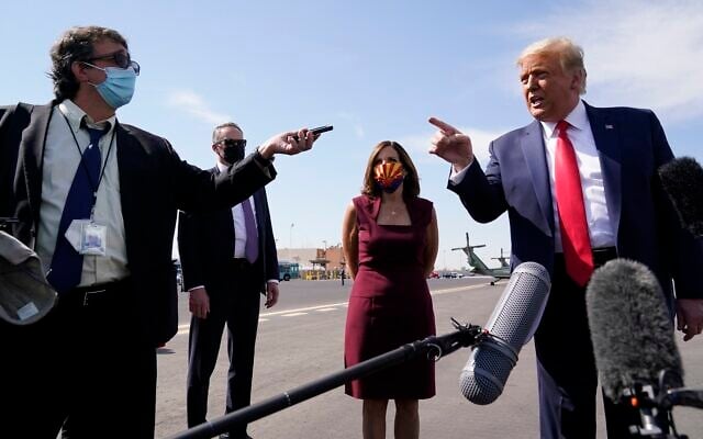 US President Donald Trump talks to reporters at Phoenix Sky Harbor International Airport, Monday, Oct. 19, 2020, in Phoenix (AP Photo/Alex Brandon) US President Donald Trump talks to reporters at Phoenix Sky Harbor International Airport, Monday, Oct. 19, 2020, in Phoenix (AP Photo/Alex Brandon)