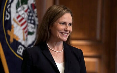 US Supreme Court nominee Amy Coney Barrett, meets with Sen. Martha McSally, R-Ariz., Wednesday, Oct. 21, 2020, on Capitol Hill in Washington. (Greg Nash/Pool via AP)