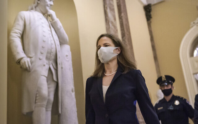 Judge Amy Coney Barrett, US President Donald Trump's nominee for the Supreme Court, arrives for closed meetings with senators, at the Capitol in Washington, October 21, 2020. (AP Photo/J. Scott Applewhite) Judge Amy Coney Barrett, US President Donald Trump's nominee for the Supreme Court, arrives for closed meetings with senators, at the Capitol in Washington, October 21, 2020. (AP Photo/J. Scott Applewhite)