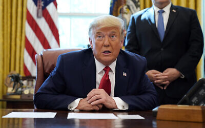 US President Donald Trump speaks while on a phone call with leaders of Sudan and Israel in the Oval Office of the White House, October 23, 2020, in Washington. (AP Photo/Alex Brandon)