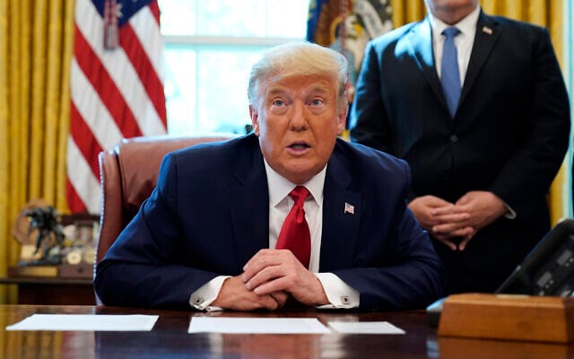 US President Donald Trump speaks while on a phone call with leaders of Sudan and Israel in the Oval Office of the White House, October 23, 2020, in Washington. (AP Photo/Alex Brandon) US President Donald Trump speaks while on a phone call with leaders of Sudan and Israel in the Oval Office of the White House, October 23, 2020, in Washington. (AP Photo/Alex Brandon)