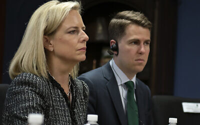 This March 27, 2018, provided by the Department of Homeland Security, then-Secretary of Homeland Security Kirstjen Nielsen and then-Department of Homeland Security chief of staff Miles Taylor, right, meet with Honduran President Juan Hernandez, not pictured, and security ministers from the Northern Triangle countries in Tegucigalpa, Honduras. Taylor, a former Trump administration official who penned a scathing anti-Trump op-ed and book under the pen name “Anonymous” made his identify public Wednesday, Oct. 28, 2020. (Tim Godbee/Department of Homeland Security via AP)