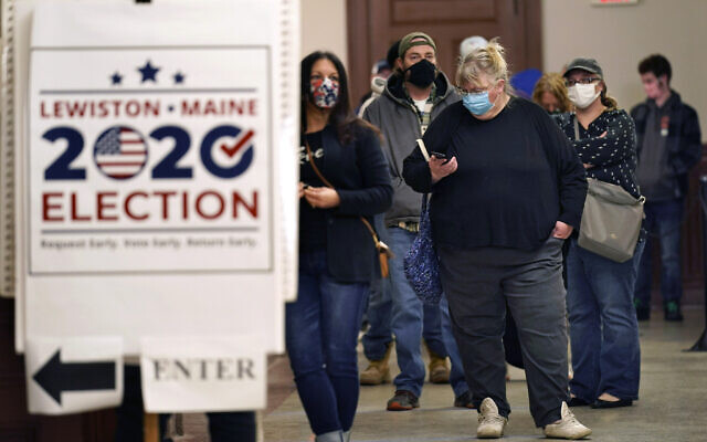 Residents wait to cast their absentee ballots during early voting, Friday, Oct. 30, 2020, in Lewiston, Maine. (AP Photo/Robert F. Bukaty) Residents wait to cast their absentee ballots during early voting, Friday, Oct. 30, 2020, in Lewiston, Maine. (AP Photo/Robert F. Bukaty)