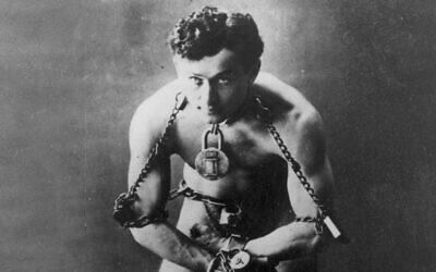 Legendary escape artist Harry Houdini is shown in chains in this photo circa 1899 (AP Photo, File)