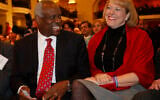 In this Nov. 15, 2007, photo, US Supreme Court Justice Clarence Thomas, left, sits with his wife Virginia Thomas, as he is introduced at the Federalist Society in Washington(AP Photo/Charles Dharapak, File)