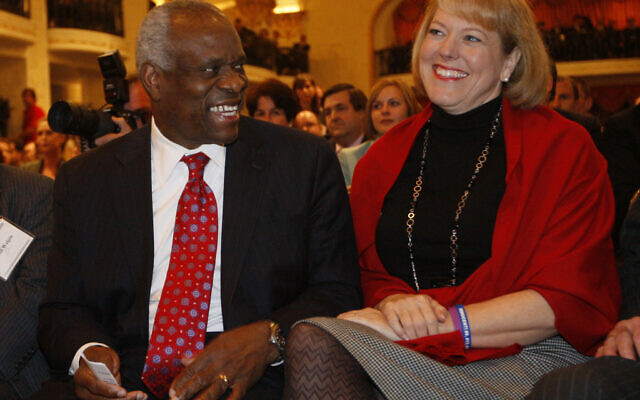In this Nov. 15, 2007, photo, US Supreme Court Justice Clarence Thomas, left, sits with his wife Virginia Thomas, as he is introduced at the Federalist Society in Washington(AP Photo/Charles Dharapak, File) In this Nov. 15, 2007, photo, US Supreme Court Justice Clarence Thomas, left, sits with his wife Virginia Thomas, as he is introduced at the Federalist Society in Washington(AP Photo/Charles Dharapak, File)