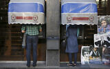 Illustrative: Iranians use ATMs of Bank Melli Iran in downtown Tehran, Iran, April 4, 2015. (AP Photo/Vahid Salemi, File)