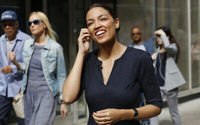 Alexandria Ocasio-Cortez, the winner of a Democratic Congressional primary in New York, talks to the media, June 27, 2018, in New York. Ocasio-Cortez, 28, upset U.S. Rep. Joe Crowley in the election. (AP Photo/Mark Lennihan)