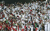 United Arab Emirates fans cheer for the team during the AFC Asian Cup group A soccer match between United Arab Emirates and India at Zayed Sports City Stadium in Abu Dhabi, United Arab Emirates, Jan. 10, 2019. (AP Photo/Kamran Jebreili)