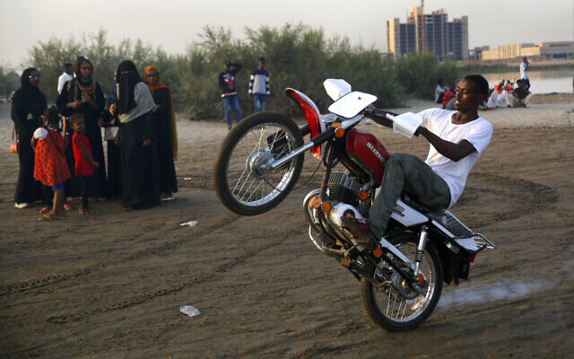 A Sudanese man performs on his motorbike on the bank of Nile River, in Khartoum, Sudan, Friday, June 21, 2019. (AP/Hussein Malla) A Sudanese man performs on his motorbike on the bank of Nile River, in Khartoum, Sudan, Friday, June 21, 2019. (AP/Hussein Malla)