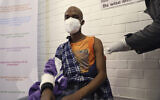 A vaccine volunteer receives an injection at the Chris Hani Baragwanath hospital in Soweto, Johannesburg, June 24, 2020v (AP Photo/Siphiwe Sibeko)