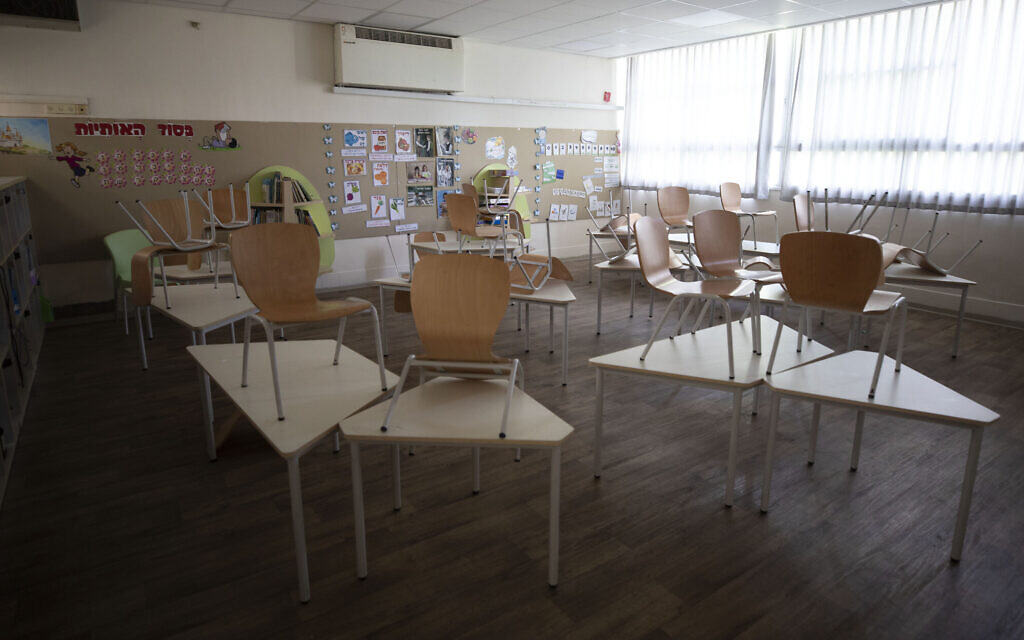 Illustrative: A classroom at an elementary school in Tel Aviv is empty after Israel closed schools ahead of a nationwide lockdown to halt the spread of the coronavirus, September 17, 2020. (AP Photo/Sebastian Scheiner) Illustrative: A classroom at an elementary school in Tel Aviv is empty after Israel closed schools ahead of a nationwide lockdown to halt the spread of the coronavirus, September 17, 2020. (AP Photo/Sebastian Scheiner)