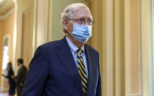 Senate Majority Leader Mitch McConnell walks to the chamber to speak about the death of Supreme Court Justice Ruth Bader Ginsburg, at the Capitol in Washington, September 21, 2020. AP Photo/J. Scott Applewhite) Senate Majority Leader Mitch McConnell walks to the chamber to speak about the death of Supreme Court Justice Ruth Bader Ginsburg, at the Capitol in Washington, September 21, 2020. AP Photo/J. Scott Applewhite)