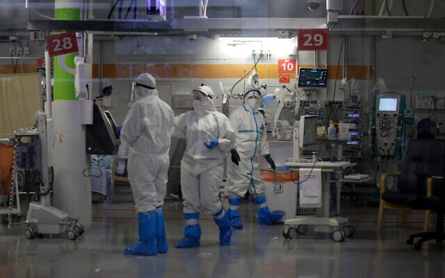 Medical professionals in full protective equipment work in in the critical care coronavirus unit, which was built in an underground parking garage at Sheba Medical center in Ramat Gan, September 30, 2020, amid a spike in COVID-19 cases. (AP Photo/Maya Alleruzzo) Medical professionals in full protective equipment work in in the critical care coronavirus unit, which was built in an underground parking garage at Sheba Medical center in Ramat Gan, September 30, 2020, amid a spike in COVID-19 cases. (AP Photo/Maya Alleruzzo)