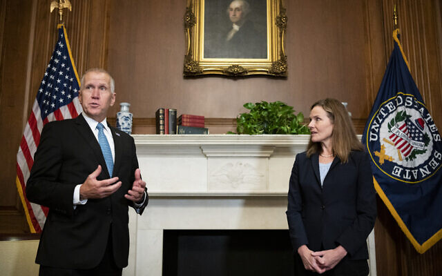 Sen. Thom Tillis meets with Judge Amy Coney Barrett, President Donald Trump's nominee to the Supreme Court at the US Capitol, Sept. 30, 2020, in Washington. (Bill Clark/Pool via AP) Sen. Thom Tillis meets with Judge Amy Coney Barrett, President Donald Trump's nominee to the Supreme Court at the US Capitol, Sept. 30, 2020, in Washington. (Bill Clark/Pool via AP)