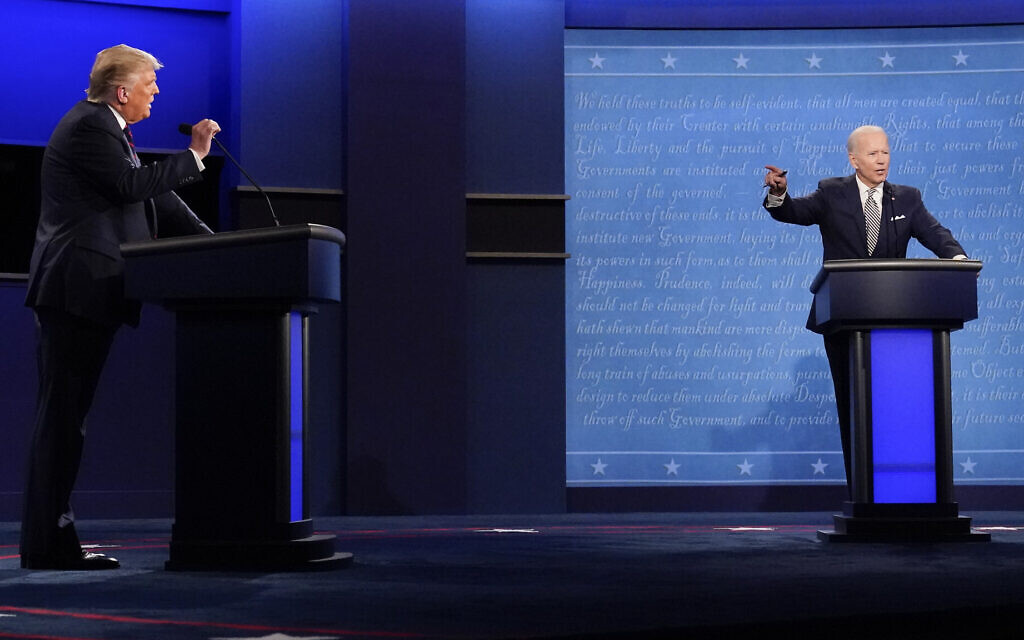 US President Donald Trump, left, and Democratic presidential candidate Joe Biden, right, gesturing during the first presidential debate, September 29, 2020, at Case Western University and Cleveland Clinic, in Cleveland, Ohio. (AP Photo/Julio Cortez)