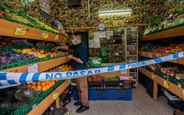 A no trespassing sign is used to keep social distance guidelines at a vegetable shop in Madrid, Spain, Oct. 6, 2020 (AP Photo/Bernat Armangue) A no trespassing sign is used to keep social distance guidelines at a vegetable shop in Madrid, Spain, Oct. 6, 2020 (AP Photo/Bernat Armangue)