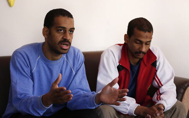 Alexanda Amon Kotey, left, and El Shafee Elsheikh, who were allegedly among four British jihadis who made up a brutal Islamic State cell dubbed "The Beatles," at a security center in Kobani, Syria, March 30, 2019. (AP Photo/Hussein Malla) Alexanda Amon Kotey, left, and El Shafee Elsheikh, who were allegedly among four British jihadis who made up a brutal Islamic State cell dubbed "The Beatles," at a security center in Kobani, Syria, March 30, 2019. (AP Photo/Hussein Malla)
