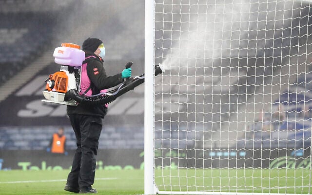 The goal frame is disinfected for Covid-19 at half time during the Euro 2020 playoff semifinal soccer match between Scotland and Israel, at the Hampden stadium in Glasgow, Scotland, Oct. 8, 2020. (AP Photo/Scott Heppell) The goal frame is disinfected for Covid-19 at half time during the Euro 2020 playoff semifinal soccer match between Scotland and Israel, at the Hampden stadium in Glasgow, Scotland, Oct. 8, 2020. (AP Photo/Scott Heppell)