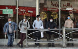 People wear protective face masks to help prevent the spread of the coronavirus in downtown Tehran, Iran, Oct. 11, 2020 (AP Photo/Ebrahim Noroozi)