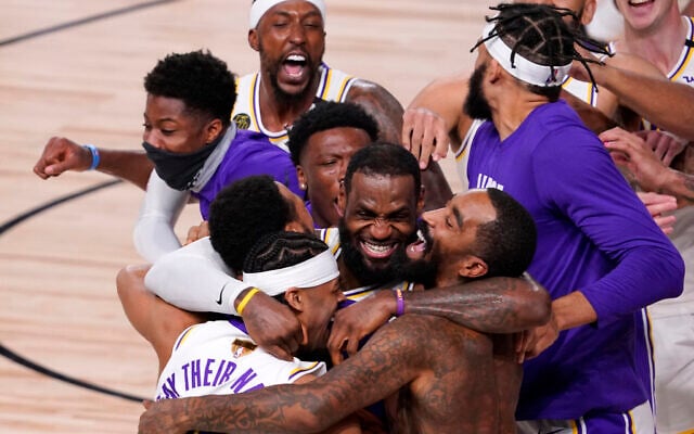 Los Angeles Lakers' LeBron James (23) celebrates with his teammates after the Lakers defeated the Miami Heat 106-93 in Game 6 of basketball's NBA Finals Sunday, Oct. 11, 2020, in Lake Buena Vista, Fla. (AP Photo/Mark J. Terrill) Los Angeles Lakers' LeBron James (23) celebrates with his teammates after the Lakers defeated the Miami Heat 106-93 in Game 6 of basketball's NBA Finals Sunday, Oct. 11, 2020, in Lake Buena Vista, Fla. (AP Photo/Mark J. Terrill)