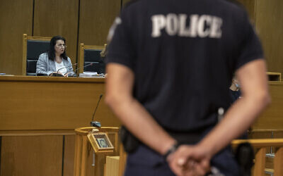 Presiding judge Maria Lepenioti reads the sentences during the Golden Dawn trial, in Athens, October 14, 2020. (AP Photo/Petros Giannakouris)