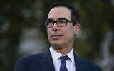 Treasury Secretary Steven Mnuchin talks with reporters outside the White House, October 14, 2020, in Washington. (AP Photo/Evan Vucci)
