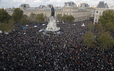 Thousands gather at Republique square during a demonstration October 18, 2020, in Paris, folliowing the behading of a history teacher in an alleged Islamist terror attack (AP Photo/Michel Euler)