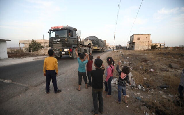 A Turkish military convoy drives through the village of Urum al-Jawz, in Idlib province, Syria, October 20, 2020. (AP/Ghaith Alsayed) A Turkish military convoy drives through the village of Urum al-Jawz, in Idlib province, Syria, October 20, 2020. (AP/Ghaith Alsayed)
