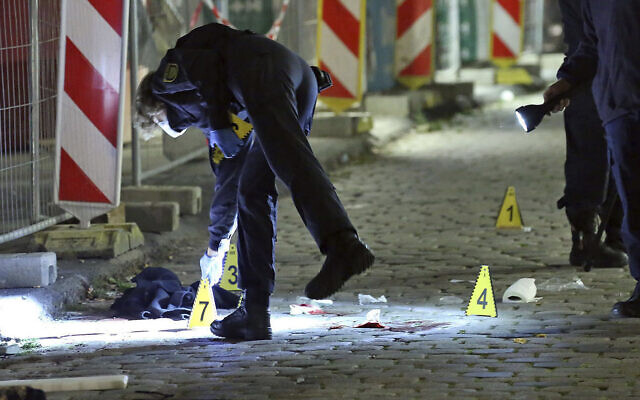 Criminal experts investigate a crime scene in Dresden, Germany, on October 5, 2020, after two people were killed in a knife attack. (Roland Halkasch/dpa via AP, file) Criminal experts investigate a crime scene in Dresden, Germany, on October 5, 2020, after two people were killed in a knife attack. (Roland Halkasch/dpa via AP, file)