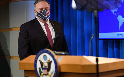 US Secretary of State Mike Pompeo arrives to speak at a news conference at the State Department in Washington on October 21, 2020. (Nicholas Kamm/Pool via AP)