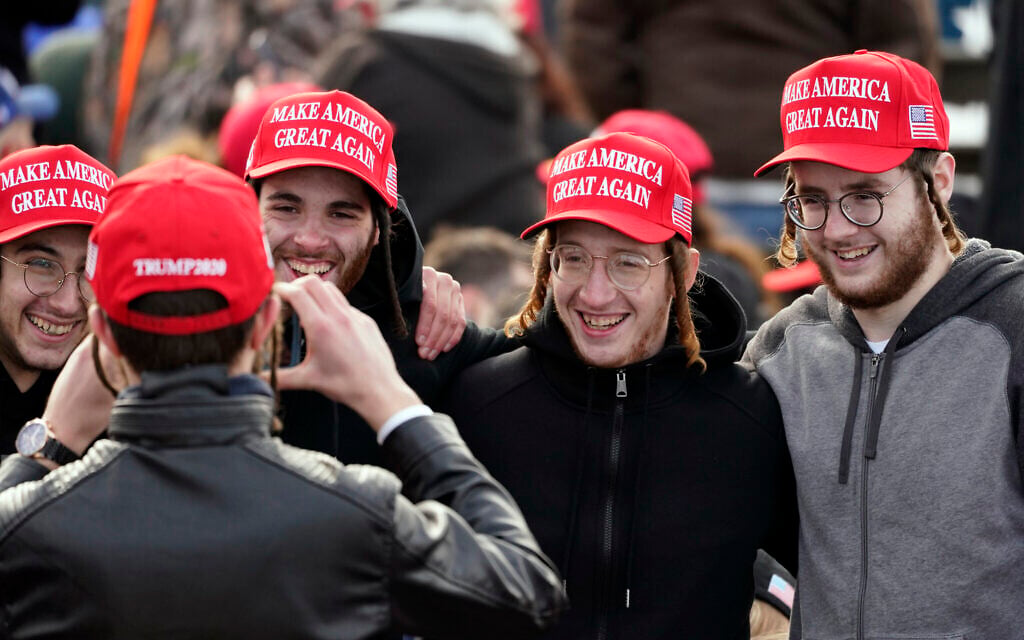 Illustrative: Supporters pose for a photo before US President Donald Trump speaks during a campaign rally at Manchester-Boston Regional Airport, October 25, 2020, in Londonderry, New Hampshire. (AP Photo/Elise Amendola)