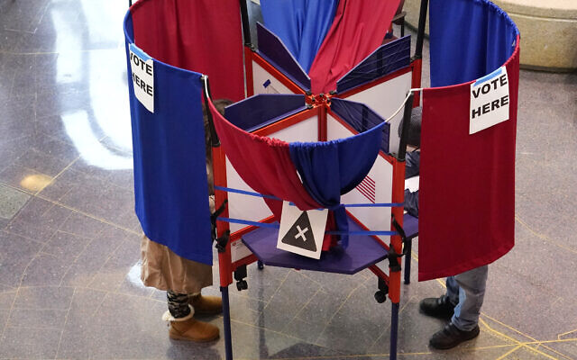 US voters mark their ballots during early in-person voting, Oct. 29, 2020, in Cambridge, Massachusetts. (AP/Elise Amendola) US voters mark their ballots during early in-person voting, Oct. 29, 2020, in Cambridge, Massachusetts. (AP/Elise Amendola)