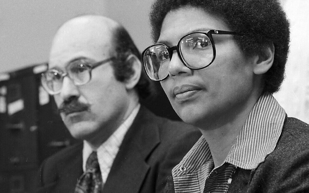 In this April 24, 1980, file photo, Olympic bronze medalist Anita DeFrantz, right, and Ira Glasser, executive director of the American Civil Liberties Union, announce a lawsuit in New York by athletes against the US Olympic Committee for depriving Americans the opportunity to compete in the Moscow Games. (AP Photo/Burnett, File)