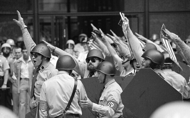 Helmeted members of the National Socialist Party of America give the Fascist salute during a rally in downtown Chicago, June 24, 1978. (AP) Helmeted members of the National Socialist Party of America give the Fascist salute during a rally in downtown Chicago, June 24, 1978. (AP)