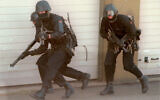 Masked soldiers of the German military special commando forces, 'Kommando Spezialkraefte' (KSK), hold their weapons ready as they move along a wall during an exercise in Baumholder, southwestern Germany, in this Sept. 11, 1997. (Hermann J. Knippertz/AP)
