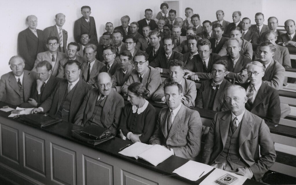 At a conference in 1937, Meitner shares the front row with (left to right) Niels Bohr, Werner Heisenberg, Wolfgang Pauli, Otto Stern and Rudolf Ladenburg; Hilde Levi is the only other woman in the room. (Friedrich Hund via WikimediaCommons)