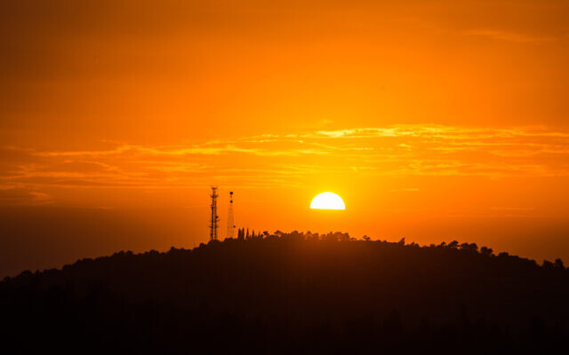 Illustrative: View of the sun setting over the mountains from Neve Ilan, outside Jerusalem. (Hadas Parush/Flash90)