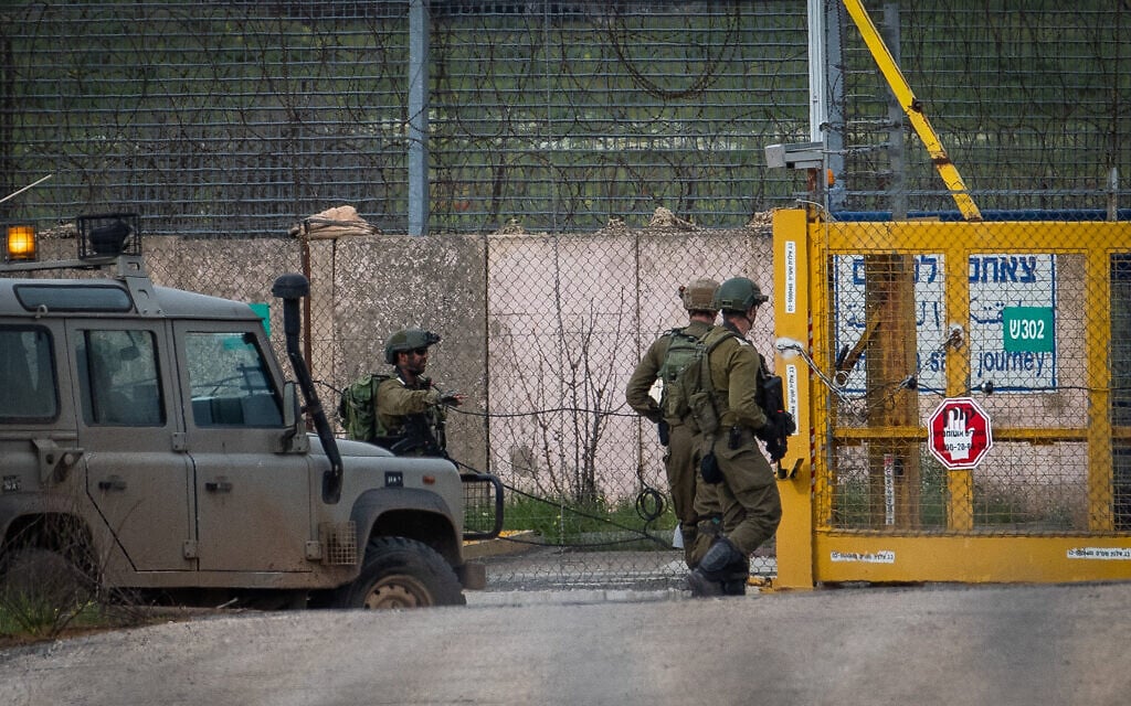 Illustrative: Israeli soldiers guard at the Israeli side of the Quneitra Crossing, on the Israeli-Syrian border in the Golan Heights on March 23, 2019. (Basel Awidat/Flash90) Illustrative: Israeli soldiers guard at the Israeli side of the Quneitra Crossing, on the Israeli-Syrian border in the Golan Heights on March 23, 2019. (Basel Awidat/Flash90)